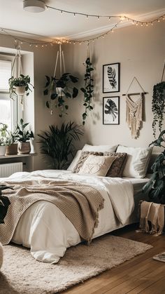 a bedroom with plants hanging on the wall