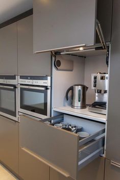 a kitchen with stainless steel cabinets and appliances