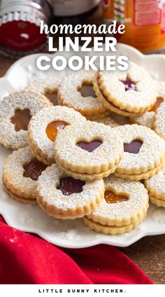 homemade linzer cookies on a plate with jam in the middle and text overlay reading homemade linzer cookies