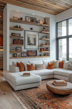 a living room filled with lots of furniture next to a large window covered in books