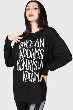 ADDAMS.- Official licenced Wednesday product.- Soft, stretch sweatshirt. - Statement custom graphics.- Text reads "Once an Addams always an Addams"- Drop shoulder slouchy style.- Cuffed sleeves.- Fitted.With KILLSTAR branding, Fabric 1: 100% Cotton, Fabric 2: 98% Polyester 2% Elastane. Machine wash cold (30°c) / Do not bleach / Do not tumble dry / Iron at low temperature / Do not dry clean. Imported.© 2022 MGM. TM Tee and Charles Addams Foundation. © 2023 MGM. ARR. Oversized Long Sleeve T-shirt With Lettering, Drop Shoulder Text Print Tops For Loungewear, Oversized Band Merch Sweatshirt With Letter Print, Band Merch Long Sleeve Sweatshirt With Slogan, Unisex Letter Print Tops For Fall, Black Band Merch Sweatshirt With Slogan, Oversized Crew Neck Band Merch Top, Black College Sweatshirt With Slogan, Oversized Band Merch Slogan Top