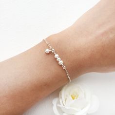 💜 Dainty Pearl Bracelet with Dangle Pearl Charm ✨ Perfect for Bridal Jewelry, Bridesmaids Gift, Birthday Gift Ideas • Handmade with genuine white Freshwater Pearls. All metal parts are high-quality sterling silver, 14K Gold Filled or Rose Gold Filled. • Pearl size: 4 mm • Every bracelet comes with a 0.5-inch extension ✨ To find your bracelet size, measure your wrist and add 0.5 - 1 inch for a room to wiggle (depending on your personal preference) • Hypoallergenic. You won’t have to worry about Birthday Gift Ideas Handmade, Dainty Pearl Bracelet, Tiny Pearl Necklace, Gift Ideas Handmade, Jewelry Hacks, Silver Pearl Bracelet, Bracelet Packaging, Gold Pearl Ring, Freshwater Pearl Jewelry