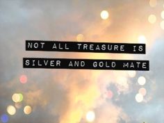 a street sign that reads not all treasure is silver and gold mate on the sky