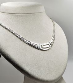 Buy a unique Handmade Silver Necklace with Greek Key Meander | Discover a large collection of Ancient Greek Jewelry in our ON-LINE shop | FREE SHIPPING all over the world This product is a beautiful silver 925 Necklace inspired by the Ancient Greek Key pattern-Meander.A meander or meandros (Greek: Μαίανδρος) is a decorative border constructed from a continuous line, shaped into a repeated motif. Such a design is also called the Greek fret or Greek key design. Visit my Home Page: https://www.etsy.com/shop/GreekHistoryArt Type We offer 1 type of necklace  Size Length:Adjustable Width:1.3cm(0.52 inches) IF YOU WANT OTHER SIZE PLEASE CONTACT US Material All my products are pure Sterling Silver. This necklace is Shiny Silver and degrade. If you wish to see more products with Meander, please vis Classic Handmade Silver Necklaces, Classic Handmade White Gold Necklace, Ancient Greek Jewelry, Ancient Greek Coin, Greek Vases, Greek Key Pattern, Greek Jewelry, Continuous Line, Line Shopping