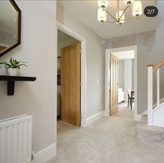 the hallway is clean and ready to be used as a living room or dining area