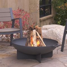 a fire pit sitting on top of a stone patio