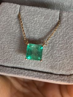 Square Cut Colombian Emerald Solitaire Pendant Drop Necklace in 14K Yellow Gold. This necklace features a medium green natural Colombian emerald, clarity: SI, Weight 1.68 Carat, Square Shaped 7.0mm x 7.0mm prong-style setting. Wheat Chain 14K Yellow Gold 16.5" total pendant necklace weight 2.55g Emeralds typically contain inclusions that are visible to the unaided eye. Because of this, trade members and some consumers understand and accept the presence of inclusions in emeralds. Eye-clean emeralds are especially valuable because they’re so rare. Emerald inclusions are often described as looking mossy or garden-like. They’re sometimes called "jardin,” which is French for garden. Formal Emerald Necklaces With Diamond Cut, Formal Hallmarked Emerald Necklace, Elegant Hallmarked Green Emerald Necklace, Luxury Emerald Cut Emerald Necklace In Yellow Gold, Luxury 14k Gold Emerald Necklace For May Birthstone, Luxury 14k Gold Emerald-cut Emerald Necklace, Hallmarked Round Emerald Necklace, Luxury Green Emerald Cut Necklace, Green Fine Jewelry Necklace For Formal Occasions