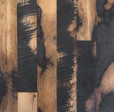 an image of wood flooring that looks like it has been painted black and brown