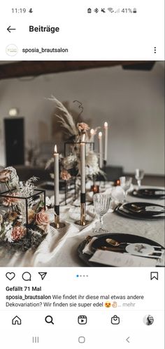 the table is set with candles and flowers