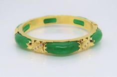 Vintage 18K Solid Yellow Gold Translucent Green Jadeite Jade & White Topaz Bamboo Bangle Bracelet ....Marked 18K...Total of weights 30.8grams...Measure inside 53MM W 8.1MM...With 06 Green Jades 21.5 x 7.5MM ...It's in very good condition. #475680 Gold Jade Bangle Bracelet, Luxury Green Gemstone Bangle, Green Bangle For Formal Occasions, Fine Jewelry Style, Elegant Jade Bangle, Green Bangle Bracelet For Anniversary, Green Bangle Bracelets For Anniversary, Luxury Green Bangle For Anniversary, Formal Jade Bangle Jewelry, Formal Jade Bangle Bracelet