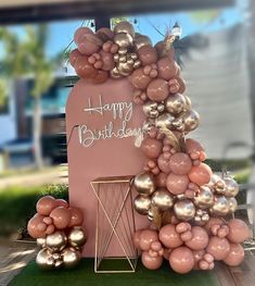 a happy birthday sign made out of balloons