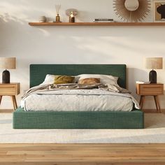 a green bed in a white bedroom with wooden flooring