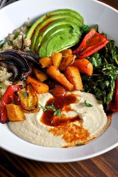 a white bowl filled with different types of food