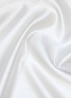 "We coined the name \"Mystique Satin\" in the 80s and its popularity has skyrocketed. Also known as Lamour Satin or Matte Satin. This fabric is 100% polyester, 62\" wide, 4.5oz, and it's extremely versatile. One side is medium shine and the other is matte. Color Shown - Ultra White To choose our other 130+ colors see our main listing here - https://www.etsy.com/listing/830110017/mystique-satin-lamour-satin-medium-shine Uses: 1. Fashion - evening wear, dresses, lining, ties, etc. You can find thi Gowns Bridesmaid, Duchess Satin, Rainbow Aesthetic, Bridal Fabric, Trendy Wallpaper, 背景 シンプル, Aesthetic Colors, Matte Satin, White Wallpaper