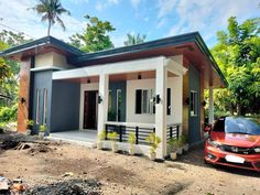 a car parked in front of a small house