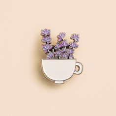 Lavender bundle in a cup enamel pin  the cutest pin to add to your bag, hat, clothing, etc. the perfect gift for plant lovers  Details:  1.25 x 1.24 soft enamel pin  black rubber clutch  This pin is attached to a 100% biodegradable seed paper! Plant it in a pot of soil or garden and grow a blend of wildflowers ✨  (pins purchased through my etsy shop are attached to biodegradable seed paper)  Designed by EVRYDAY MONDAY Lavender Bundle, Enamel Pin Backpack, Enamel Pin Collection, Cat Enamel Pin, Backpack Pins, Soft Enamel Pins, Seed Paper, Soft Enamel, Cute Pins