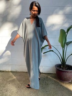 Embrace the gentle waves and sunny shores with our double gauze cotton kaftan. This versatile caftan falls gracefully between the knees or ankles, depending on the length you choose. It's the ultimate in loungewear for women - perfect as a beach dress or cover up. Crafted from light and airy double gauze cotton, it's your essential for a night on the town, a day by the sea, or just running errands. Casual V-neck Kaftan For Daywear, Casual Linen Maxi Dress For Loungewear, Spring Linen V-neck Kaftan, Summer Tunic With Batwing Sleeve And Relaxed Fit, Casual V-neck Relaxed Fit Kaftan, Spring Maxi Tunic With Relaxed Fit, Spring Maxi Length Tunic With Relaxed Fit, Summer Maxi Dress With Relaxed Fit For Loungewear, Casual Linen V-neck Kaftan