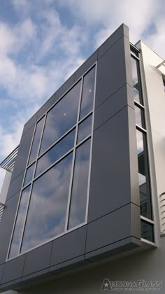 the side of a building with windows and balconies on it's sides