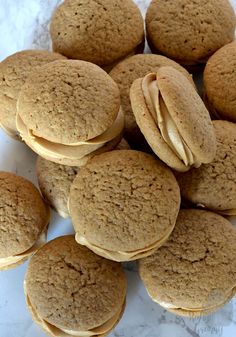 a pile of cookies sitting on top of a white counter