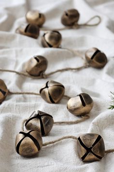 several bells tied together on a white cloth