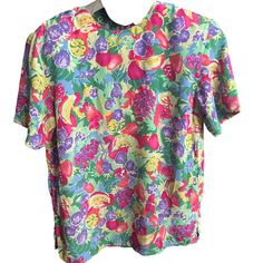 "In flawless vintage condition from the late 1980's/early1990's by Galinda Wang This short sleeve pastel blouse is perfect for spring and summer! With an abstract fruit theme in different colors of pink, yellow, light red, green, blue, purple, small (removable) shoulder pads, a scoop neck, keyhole back closure with lime green button, and small slits up side Featuring strawberries, blackberries, bananas, grapes, cherries, and lemons it is really such a cute and unique top! Lightweight 100% polyester great for layering No size tag but it is a loose and flowy shirt good for a medium or large Measurements: Length:25\" Shoulder to shoulder:18\" Pit to pit:20\"" Different Colors Of Pink, Pastel Blouse, Flowy Shirt, Unique Top, Green Button, Pink Blouse, Light Red, Womens Clothing Tops, Blouses For Women