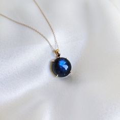 This stunning pendant is set in 14k Solid Yellow Gold with Natural Labradorite having a beautiful blue sheen. It is an unique gemstone pendant for nearly every occasion and is completely hassle-free jewelry. ITEM DETAILS: * GEM: Labradorite  * GEM Size: 15x15mm * GEM Shape: Round * Gem Weight: 11.55 carats * Gold Purity: 14KT  * Gold Weight: 0.77 gram * Total Weight of the Pendant: 3.08 gram The Gold purity is guaranteed and it comes with an authentic 14KT gold hallmark. Since my items are handmade, they are absolutely nickel and lead free. CUSTOMIZATION: * Gemstone customization is available and it can be substituted with a gem of your choice. Kindly message me for the same. PACKAGING * The Pendant comes with layers of safe and secure wrapping along with a Free handmade jewelry box with e Blue Gemstone Necklace In Labradorite, Elegant Labradorite Necklaces With Birthstone, Blue Labradorite Gemstone Necklace, Elegant Birthstone Jewelry With Labradorite, Elegant Labradorite Necklace For Gift, Elegant Labradorite Necklace Gift, Ethereal Jewelry, Faberge Jewelry, Gem Pendant