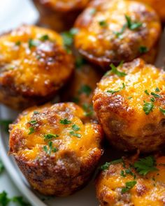 mini cheese muffins on a white plate with parsley