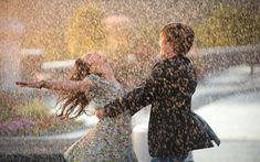 a man and woman dancing in the rain with an inspirational quote above them that says, and when you get the choice to sit it out of dance, hope you dance