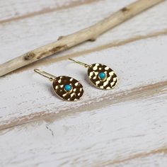 Our Petal Drop earrings with sleeping beauty turquoise stone feature a hand-hammered gold texture that reflects the light creating a subtle shimmer and elegant sparkle. These timeless lightweight earrings are the perfect compliment to any look, day or night. They're also the perfect gift for Mom, bridesmaids, your bestie or yourself! Details Lightweight drop earrings Made with genuine sleeping beauty turquoise stone 14k gold plated brass Dimensions: 5/8” wide x 1 1/2” long Blue Hammered Earrings For Gift, Turquoise Hammered Earrings For Gift, Unique Turquoise Drop Earrings, Elegant Blue Hammered Earrings, Blue Hammered Drop Earrings, Turquoise Hand Forged Drop Earrings, Gift Turquoise Brass Earrings, Turquoise Gold Plated Drop Earrings, Sleeping Beauty Turquoise Jewelry