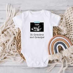 "This personalized baby outfit is a sweet way to announce your miracle on the way. Personalize it with your own ultrasound, a phrase of your choice, and the color of the \"tape\" that holds the ultrasound up (blue, pink, or yellow). HOW TO ORDER: * Select the color and size you want and add the item to your cart * Enter your personalization: What phrase you want and what color \"tape\" - blue, pink, or yellow * After purchasing, send me a message with your ultrasound photo (make sure to include Personalized White Bodysuit For Gift, Personalized Fitted Onesie For Gender Reveal, Personalized White Onesie As A Gift, Personalized White Onesie As Gift, Customizable White Onesie As A Gift, Customizable White Onesie As Gift, Family Matching Custom Print Onesie For Gender Reveal, White Short Sleeve Bodysuit As A Gift, White Short Sleeve Bodysuit As Gift