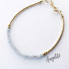 This beautiful angelite gemstone bracelet is handcrafted with 3mm natural angelite beads. The gold beading is done with high quality Japanese Miyuki Duracoat delica seed beads. The larger round gold beads are 14k gold filled for lasting quality. A 14k gold filled spring clasp completes the look. It's the perfect bracelet for layering or wearing all on its own! It's simple, yet elegant design makes it a great option for every day wear. This bracelet can be purchased in either 14k gold filled or s Handmade Gold Beaded Bracelets For Meditation, Adjustable Spiritual 14k Gold Filled Beaded Bracelet, Delicate Gold Faceted Beaded Bracelets, Spiritual Handmade Yellow Gold Beaded Bracelets, Gold Beaded Bracelets With Gemstone Moonstone Beads, Gold Beaded Bracelets With Amazonite Round Beads, Handmade Gold Moonstone Beaded Bracelets, Gold Beaded Bracelets With Moonstone, Gold Moonstone Bracelets With Natural Stones