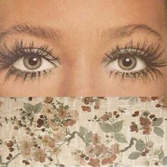 the eyes of a woman with long lashes and flowered fabric behind her are shown