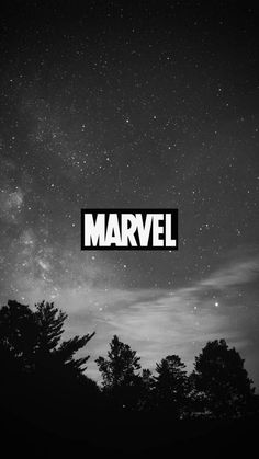 black and white photo with the word marvel above trees in front of a night sky