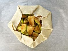 an unwrapped pita filled with food on top of a table