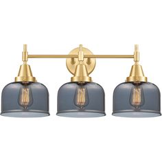 three light bathroom fixture with blue glass shades and gold metal fittings on the arms