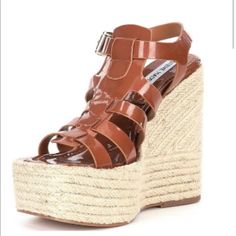 Brand New Steve Madden Sandals Brown Flat Heels With Buckle Closure, Brown Wedge Sandals With Ankle Strap And Woven Sole, Brown Ankle Strap Wedge Sandals With Woven Sole, Trendy Brown Sandals With Woven Sole, Brown High Heel Sandals With Woven Sole, Brown Open Toe Heels With Woven Sole, Summer Brown Open Heel Heels, Brown Flat Platform Sandals, Brown Summer Wedge Sandals With Buckle Closure