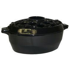 a black casserole dish on a white background