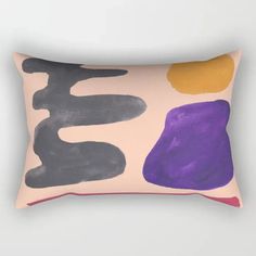 a rectangular pillow with an abstract design on the front and back, in pink, purple, yellow and black