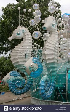 an art installation made out of glass and plastic seahorses with bubbles on them