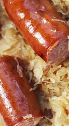 two sausages and rice on a plate