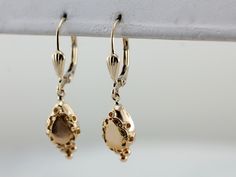 These high karat gold drops are modern, but have a feel of the Etruscan Revival to them. Securely paired with comfortable lever-back earring findings, these drops catch the light in a lovely way! Metal: 18K Yellow Gold with 14K Yellow Gold Leverbacks Earrings Length: 32 mm Earrings Width: 8 mm Marks: "14K" Stamped on the Findings Earring Findings, Eternity Bands, Pretty Things, Pearl Earrings, Yellow Gold, Drop Earrings, Yellow, Gold