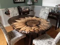 a dining room table with sunflower painted on it