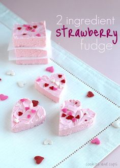 several pieces of cake with pink frosting and hearts