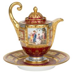 a fancy tea set with pictures on it