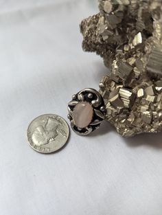 This is a vintage, adjustable cocktail ring from the mid 60s-70s. There is a pink, probably rose quartz, stone set in silver-tone metal. It's in good vintage condition with a stable color to the metal (not turning brass, green, or rusting.) Weighs 5g. 3cm x 2cm. Size: adjustable. Free domestic shipping. Vintage Adjustable Nickel-free Crystal Ring, Rose Vintage, Pink Stone, Quartz Rose, Stone Settings, Cocktail Rings, Adjustable Rings, Rings Statement, Rose Quartz