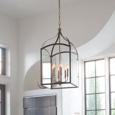 a chandelier hanging over a dining room table