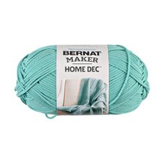 bernat maker home decor yarn in light blue, on a white background with the tag