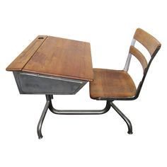 an old school desk and chair with metal frame on the back, against a white background