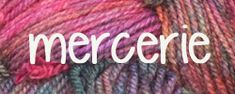 yarn with the word mercreie written in white and pink on top of it