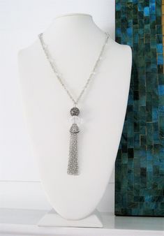 "Four different styles of silver beaded tassel necklaces to choose from, designed and handmade by Ralston Originals. I made all the tassels with silver chains, and covered each in a beautiful antique silver metal bead cap. The first beaded necklace (Pictures 1-3), is made with a very unique and beautiful large silver bead, with many tiny crystal inlaid accents. The necklace is also made with a large antique silver crystal roundel, and a large clear crystal bead. The beaded chain on the necklace Adjustable Long Tassel Necklace With Dangling Beads, Handmade Silver Long Tassel Necklace, Tassel Necklace With Round Beads For Gifts, Adjustable Beaded Chain Tassel Necklace As Gift, Adjustable Tassel Necklace With Dangling Beads As Gift, Adjustable Tassel Necklace With Dangling Beads For Gift, Beaded Dangle Tassel Necklace For Gift, Beaded Tassel Dangle Necklace For Gifts, Gift Beaded Dangle Tassel Necklace